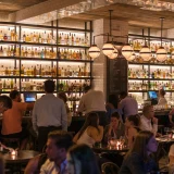 Group of People Gathering Inside Bar